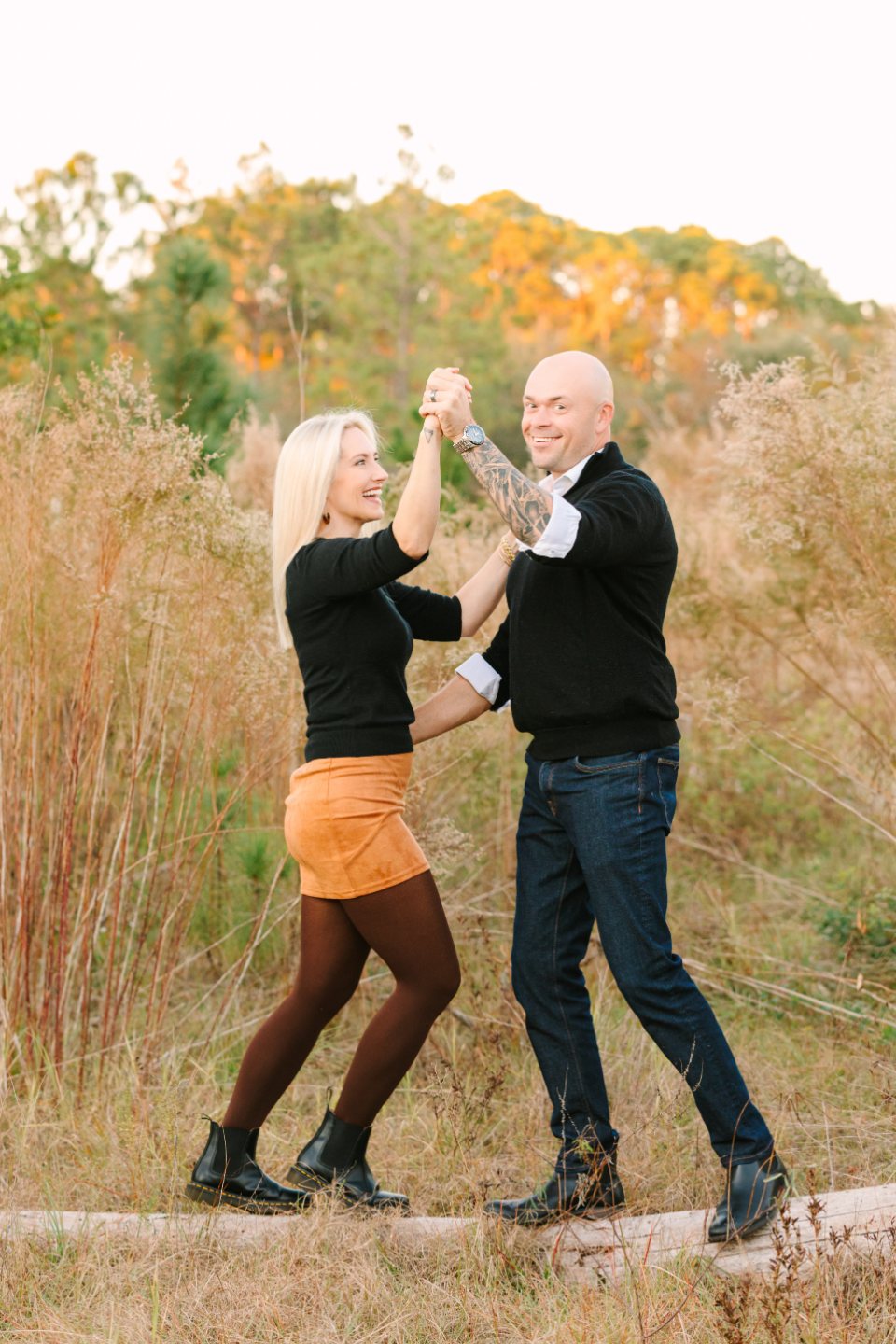 Couple dancing in a field of tall golden grass
